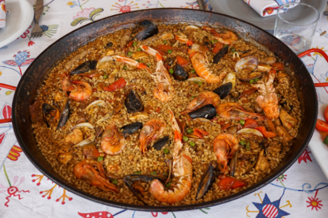 A picture of a meal with shrimp, clams, and other ingredients.